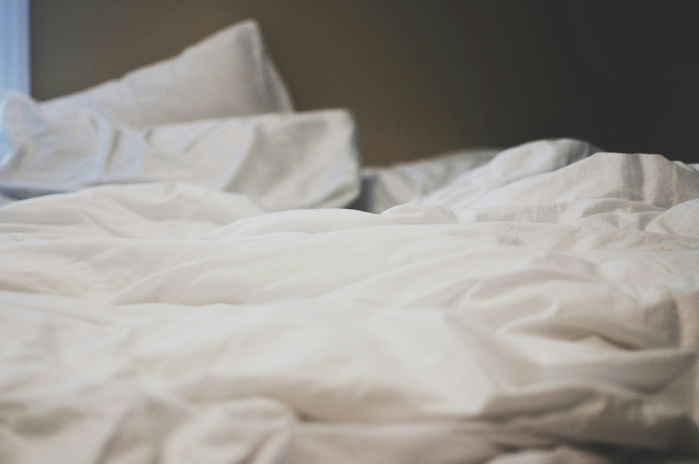 If you have blood stains on your bedding or sheets, here's how to get it out. Pictured: White bedding