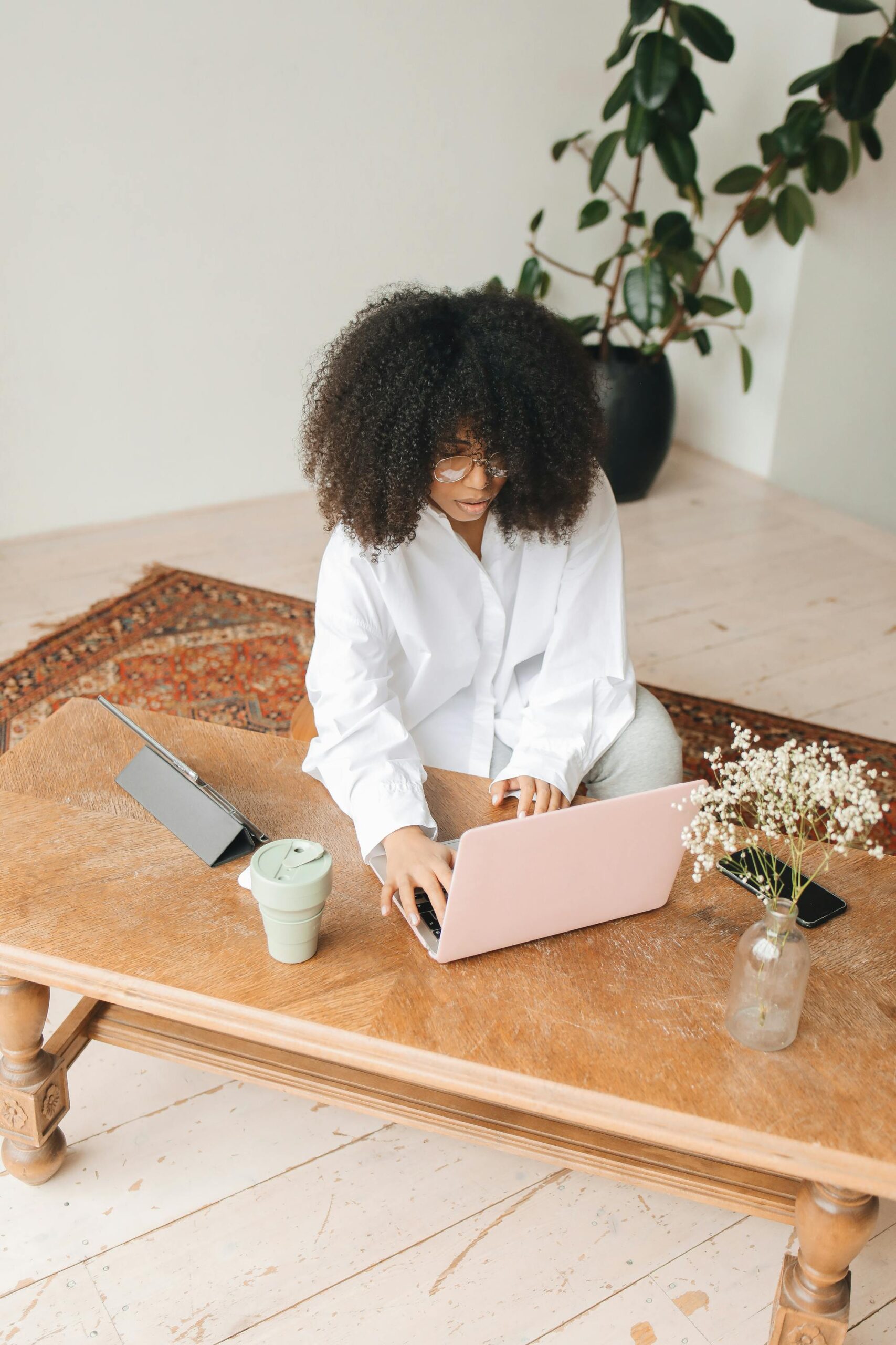 Woman typing at desk 