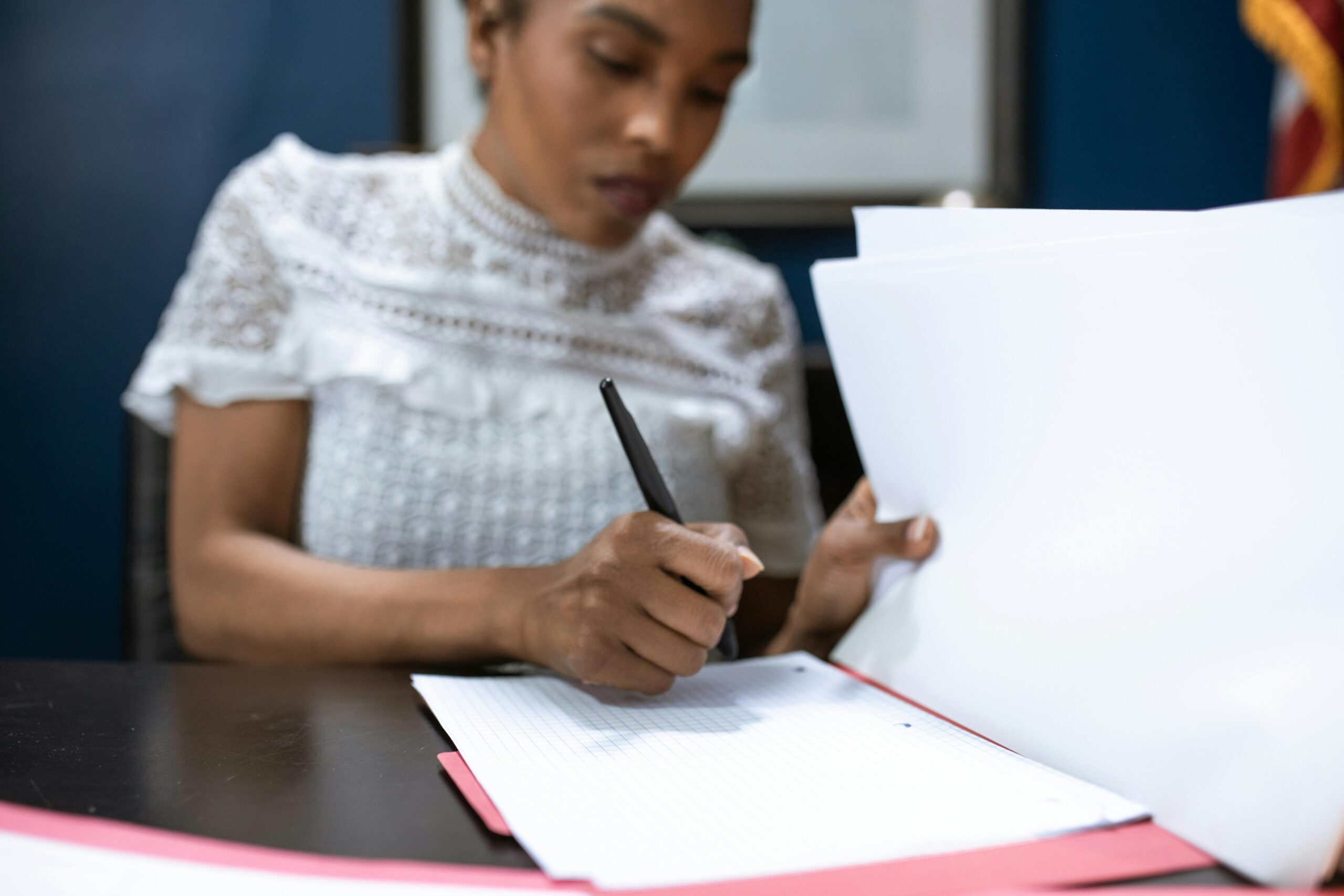 Woman signing papers