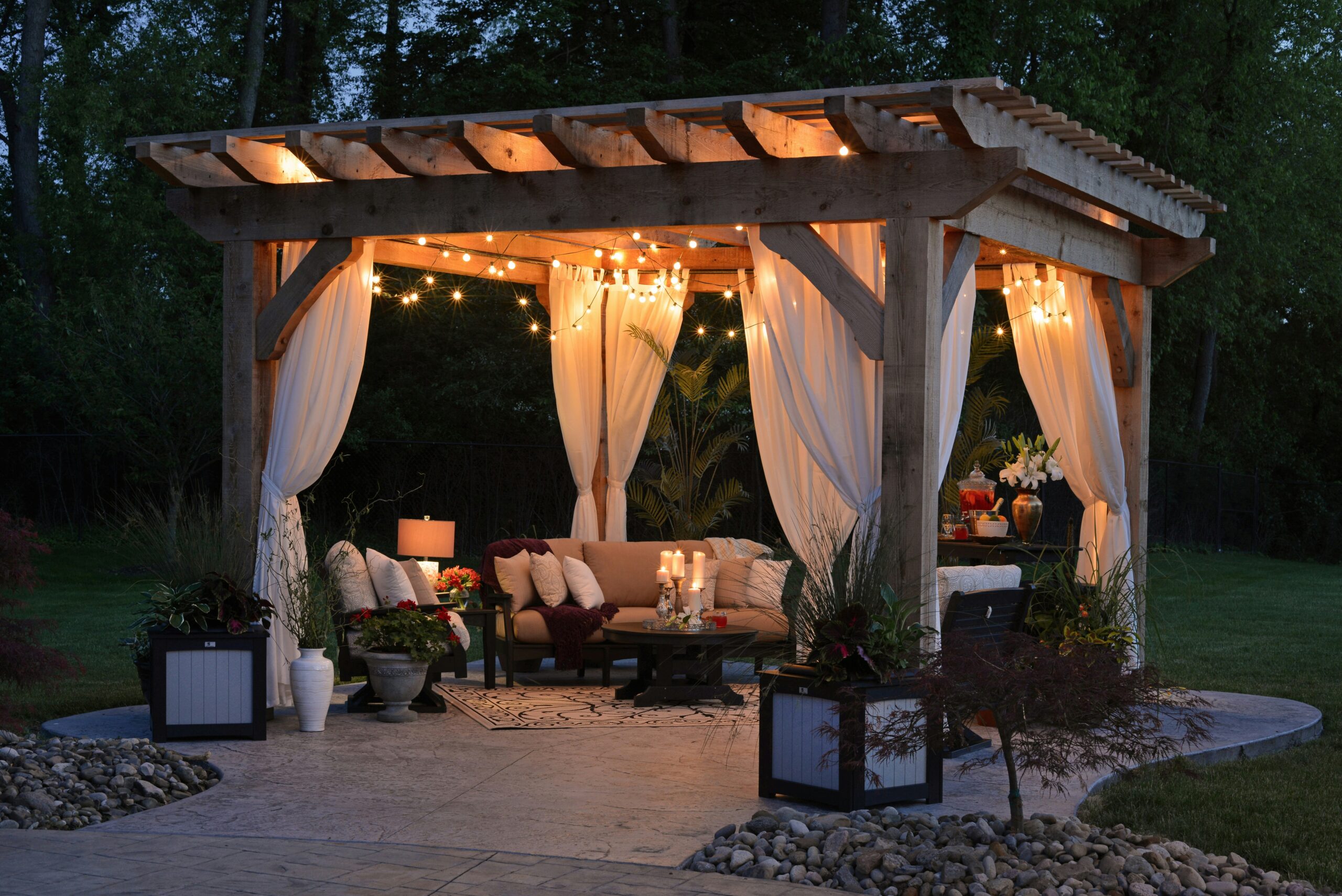 A backyard gazebo at night