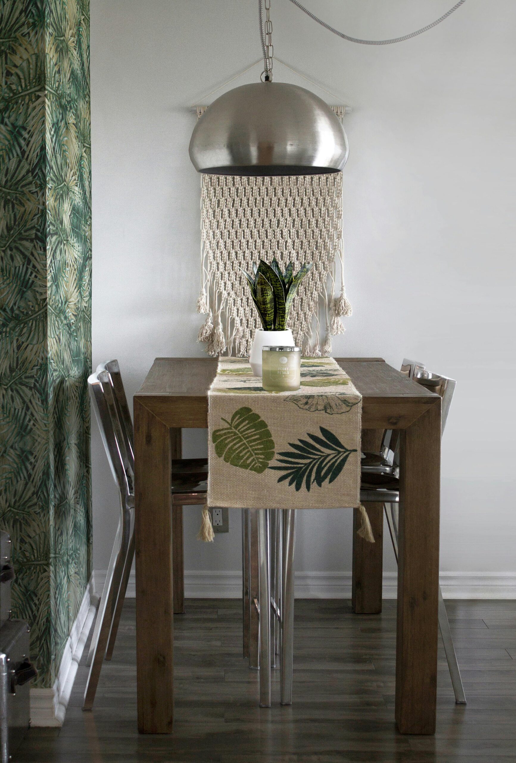 A dining room with tropical decor