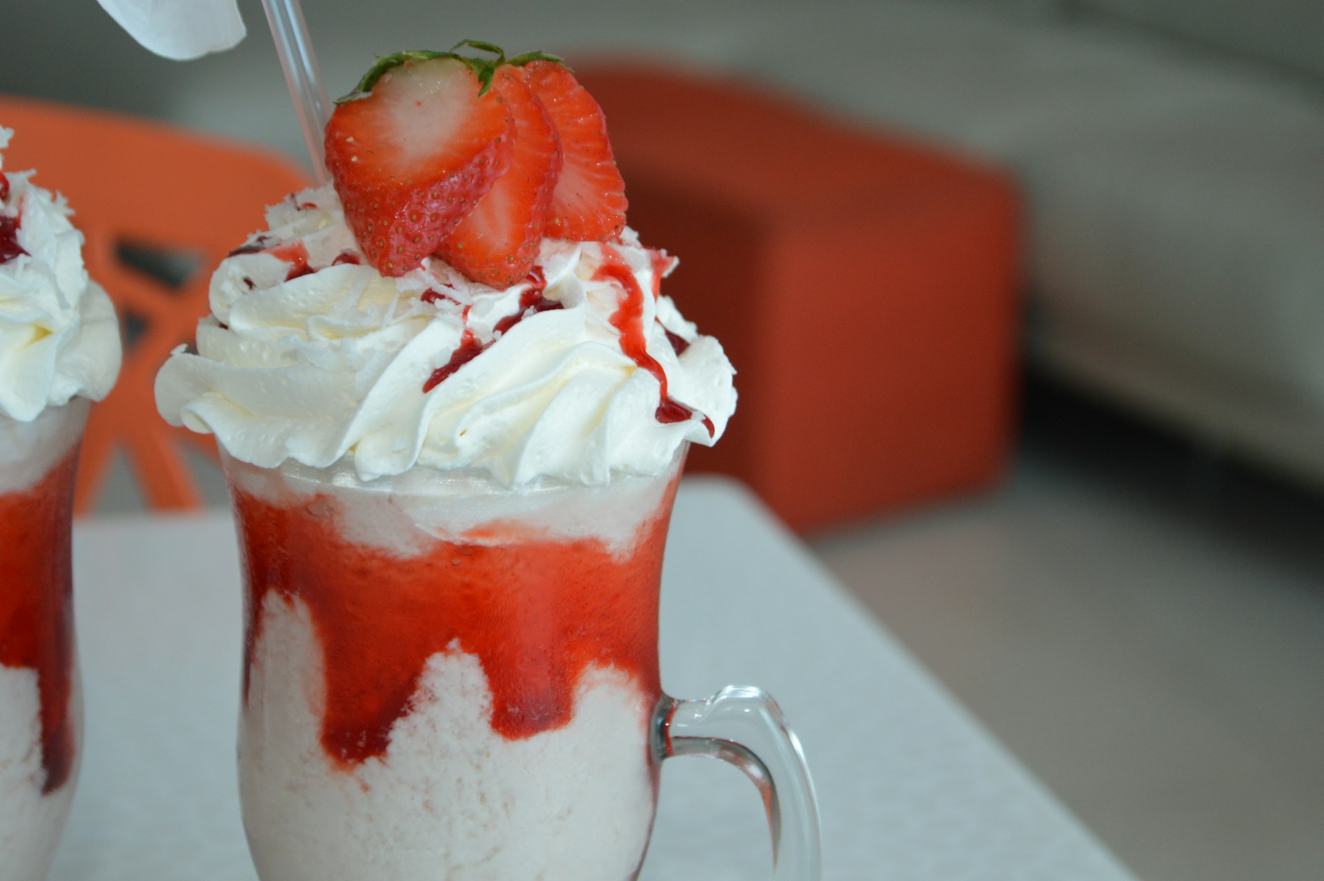 Pina Colada with strawberries and whipped cream.