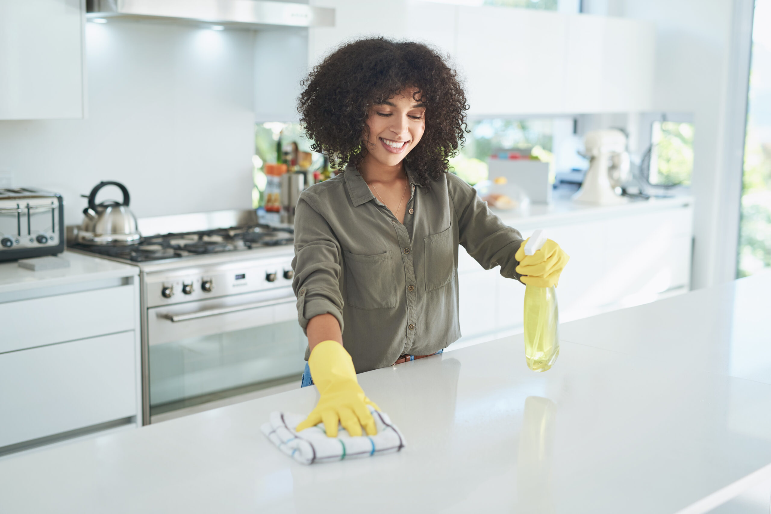 woman cleaning kitchen 