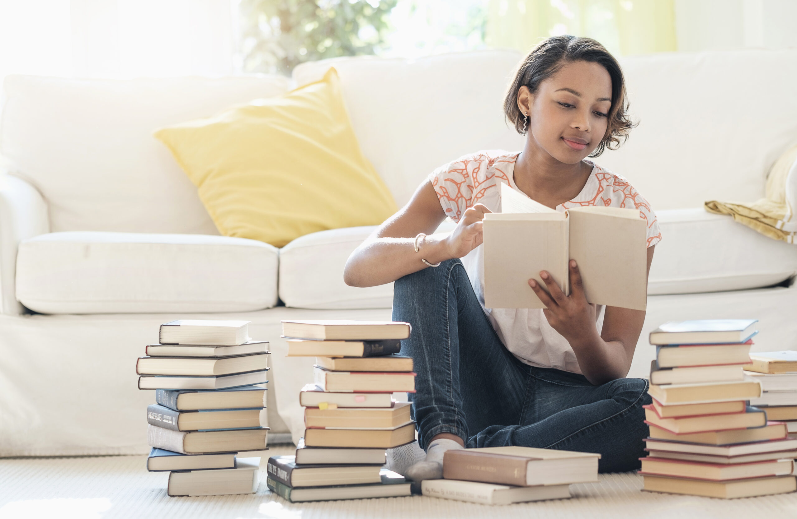 woman sorting through books