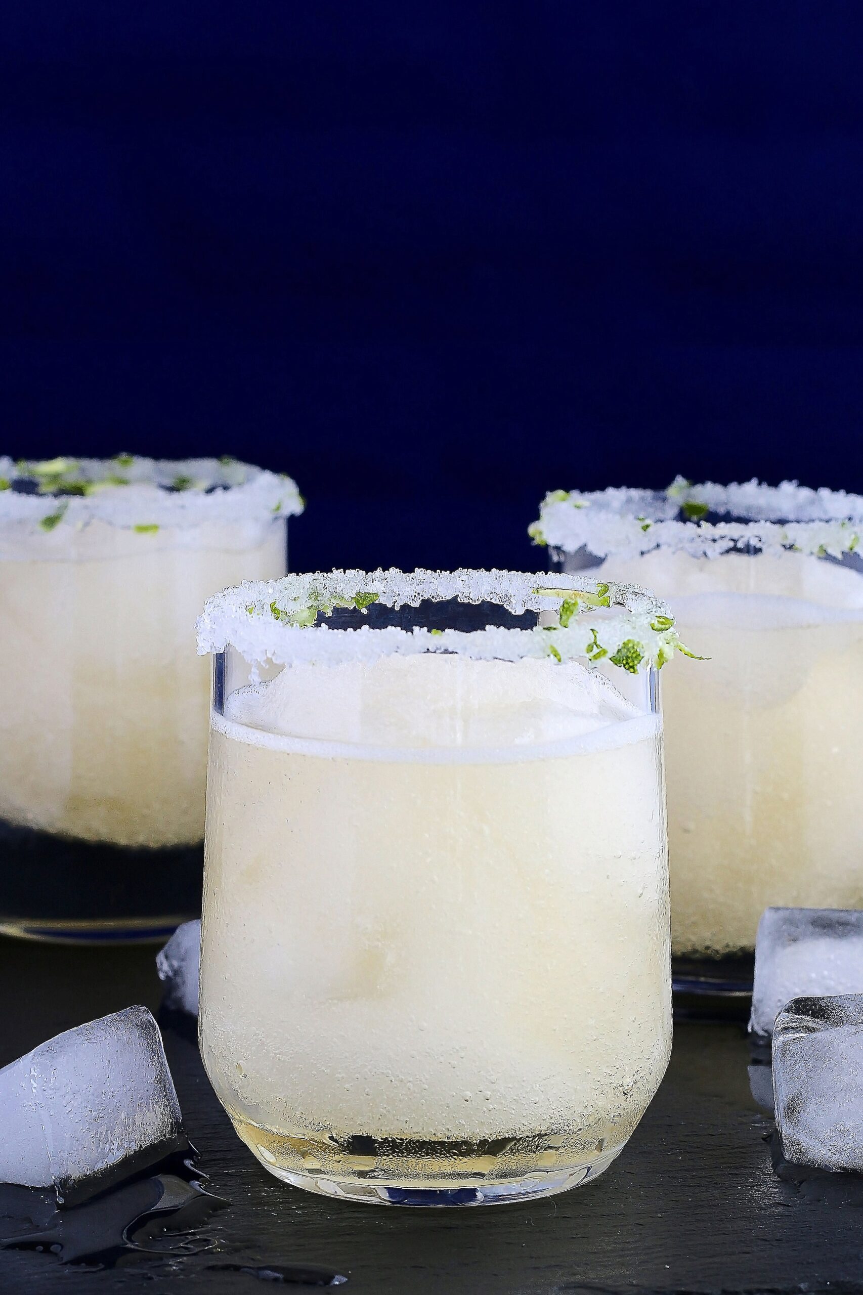 Image of three glasses of frozen margaritas.