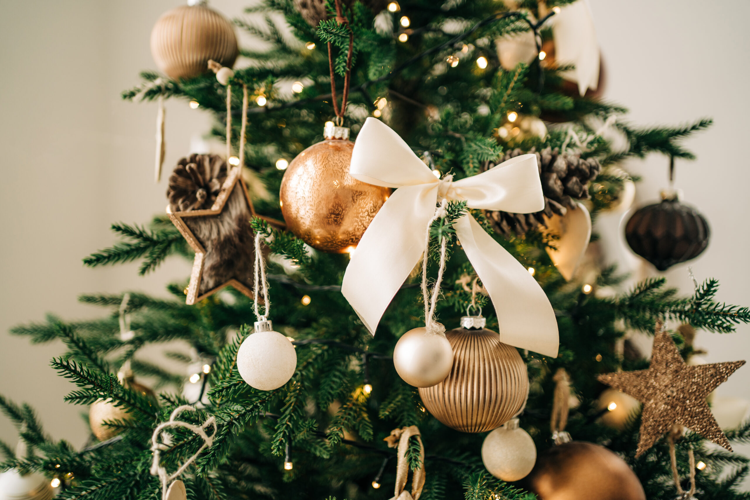 Christmas tree with many different decorations and festive garland. New Year celebration concept. Beautiful backdrop for your design