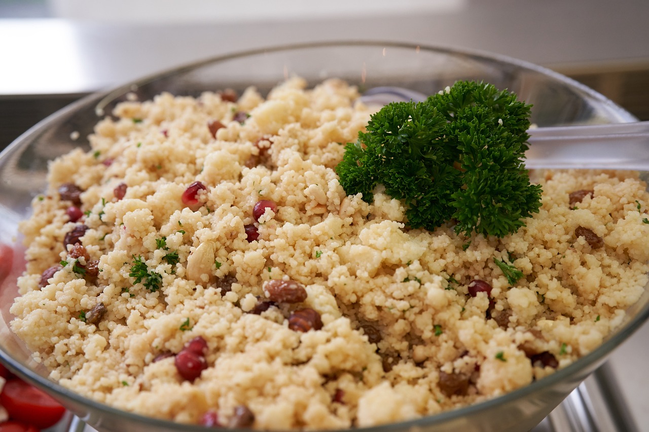 Couscous with a piece of broccoli on the side