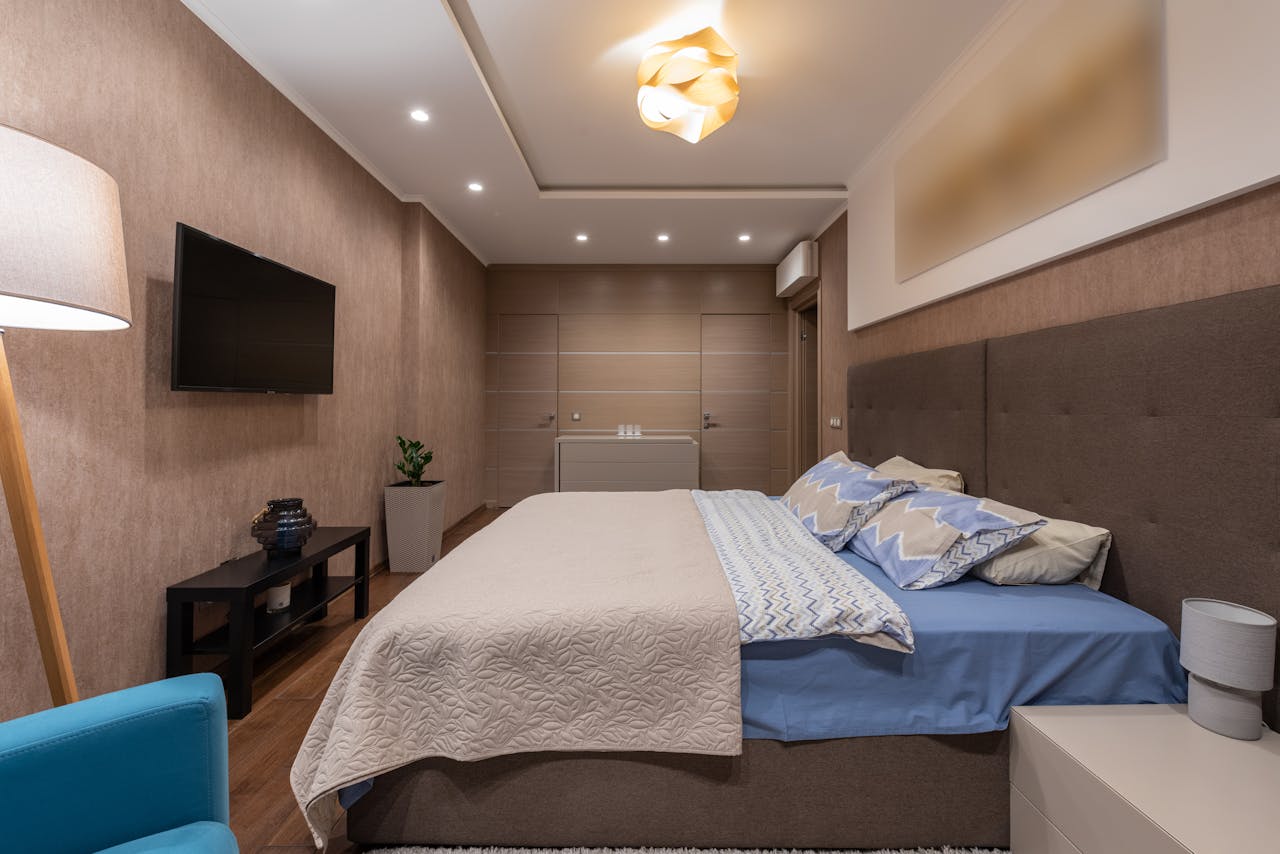 Light blue and beige comforter with tan walls