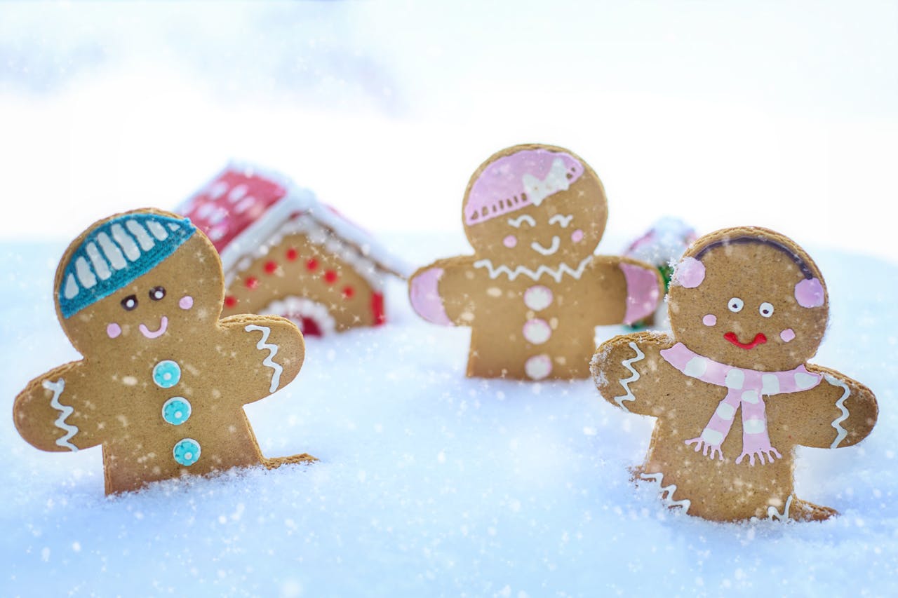 Gingerbread cookies covered from the waist down in white liquid