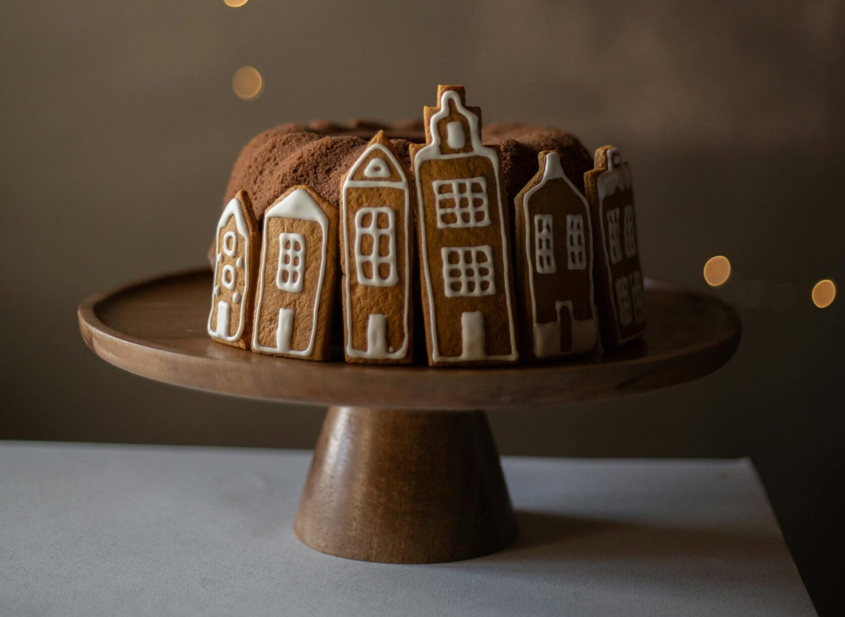 Gingerbread pieces surrounding a bundt cake