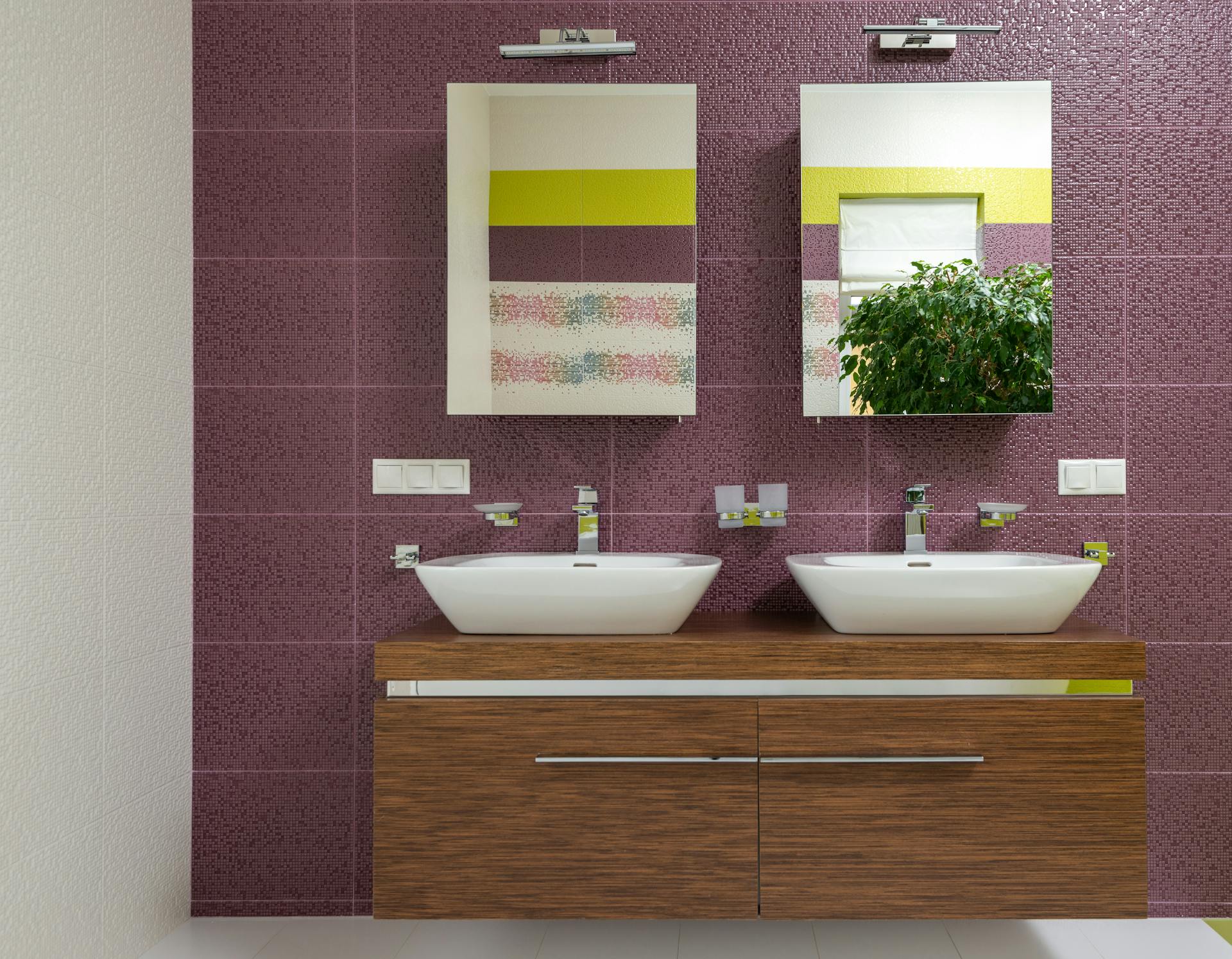 Bathroom with purple, yellow and white design wall art