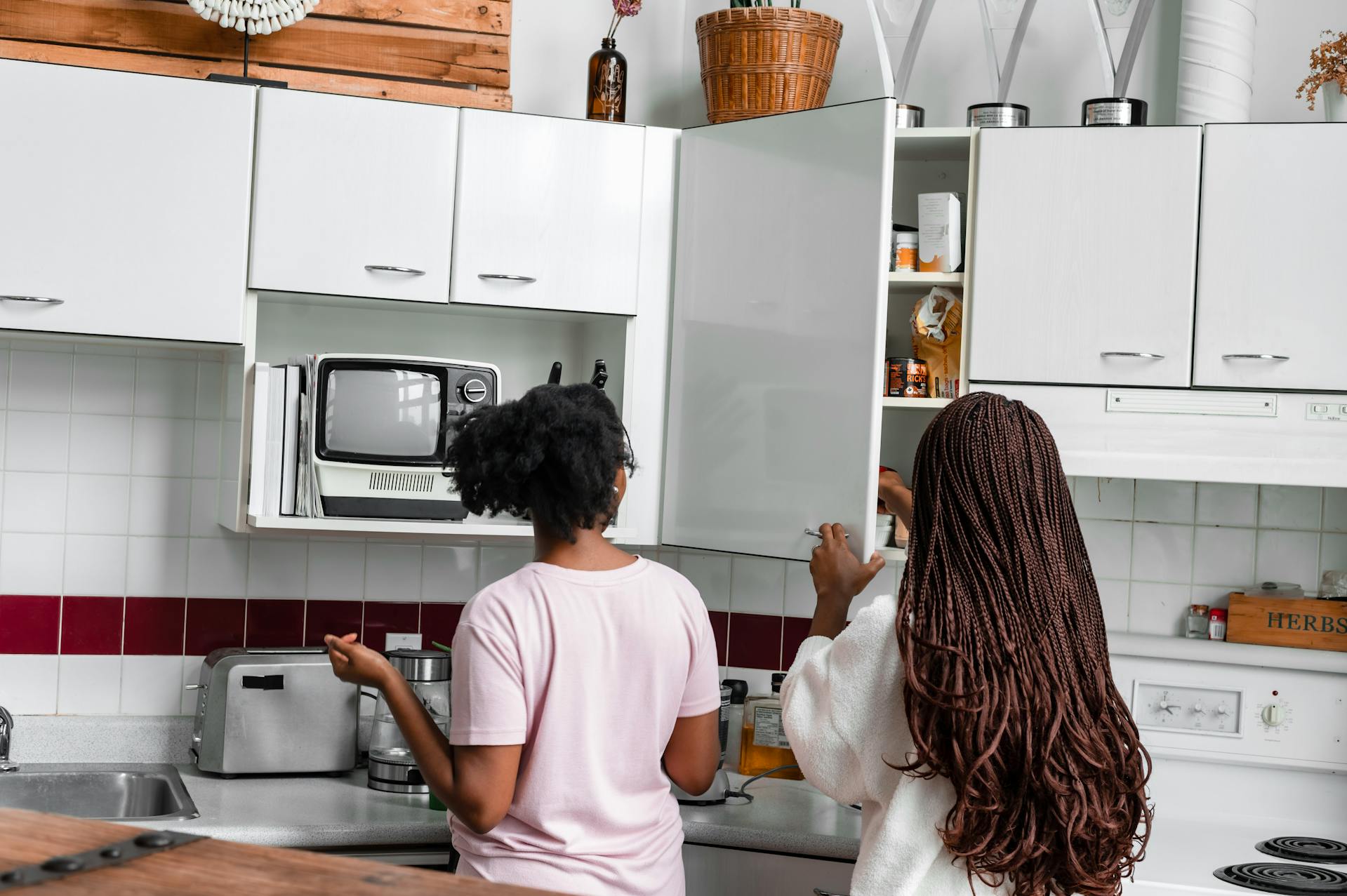 Maroon tiles on kitchen backsplash