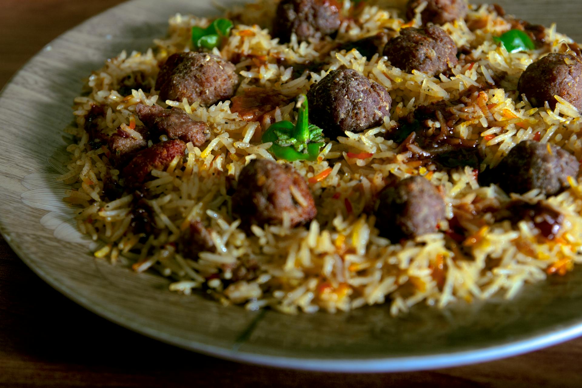 Cooked Rice With Green Vegetable and Vegan Meatballs on White Ceramic Plate