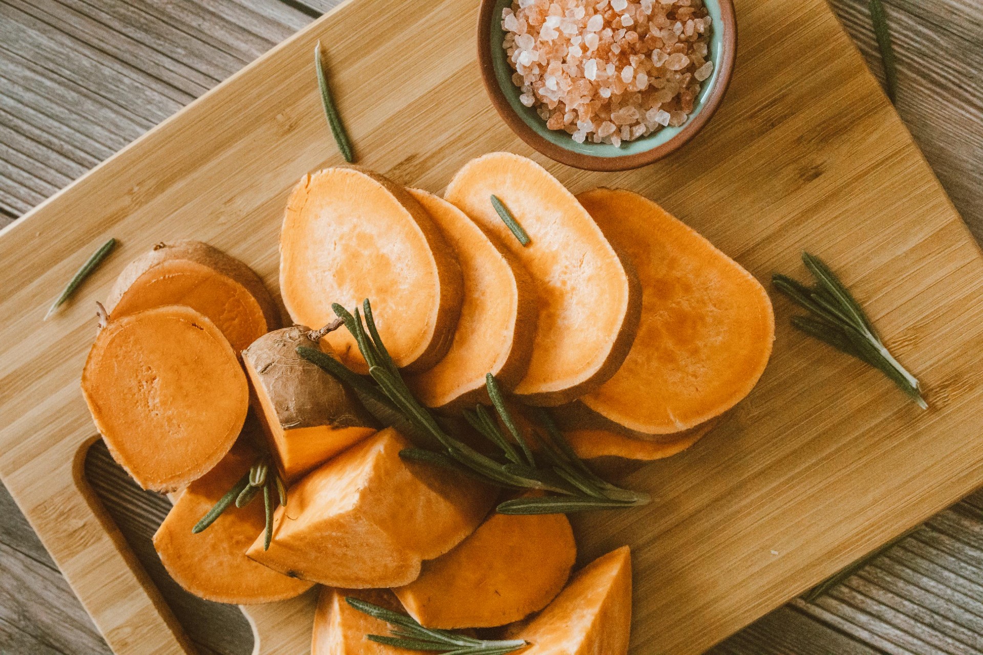 Sweet potators sliced on a cutting board