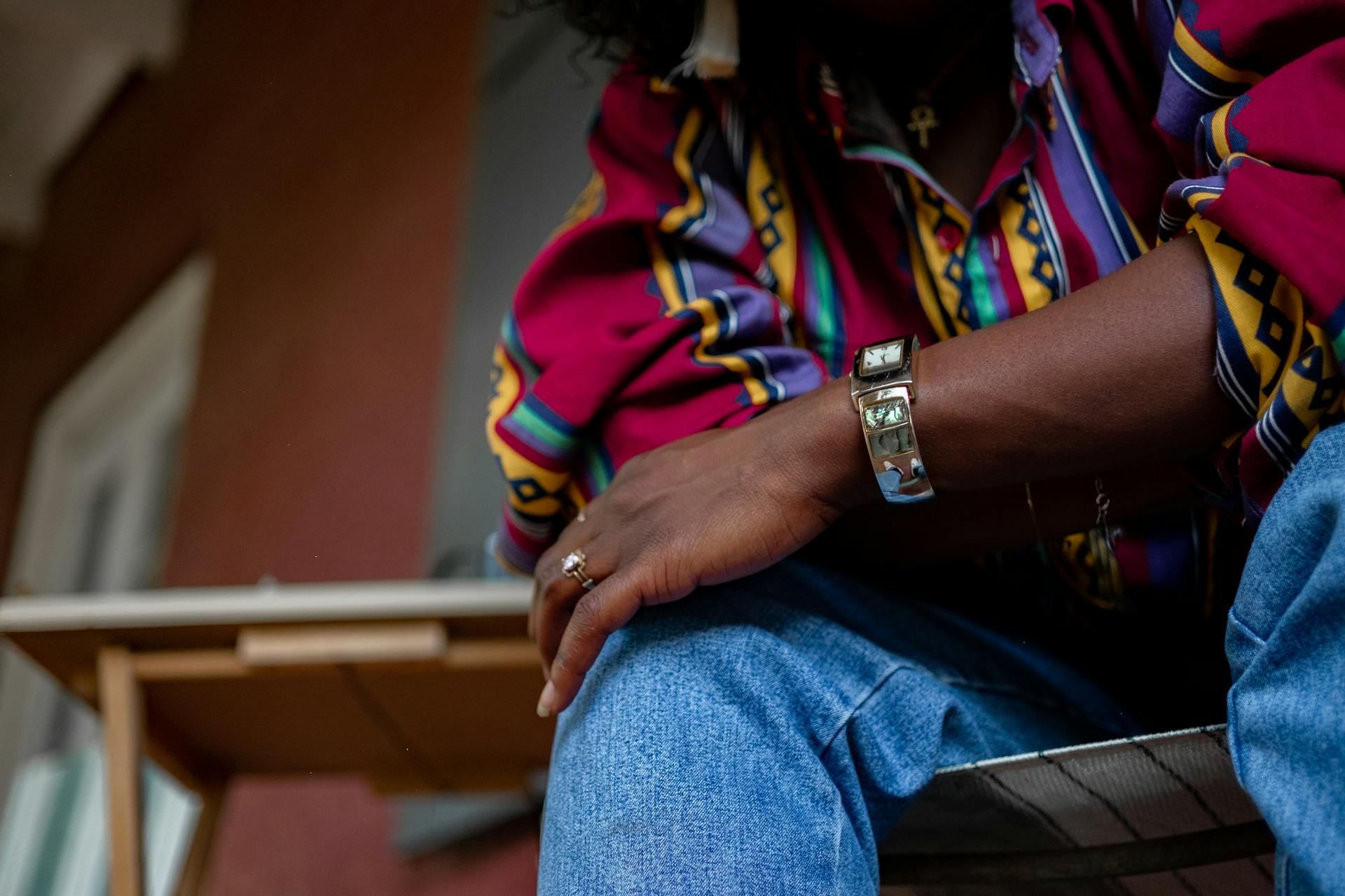 Man waits outside for someone while wearing watch