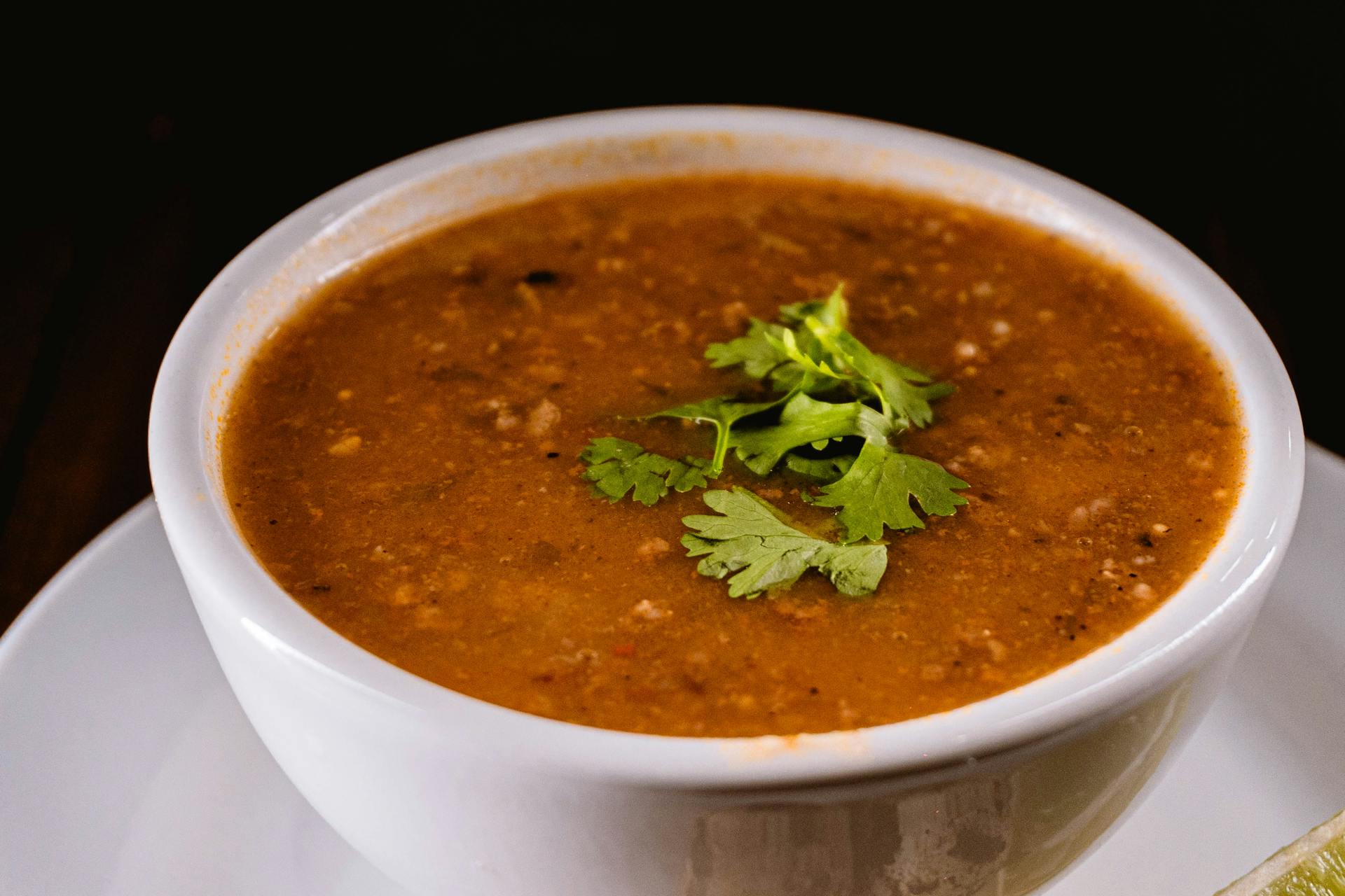 Lentil soup in a white bowl