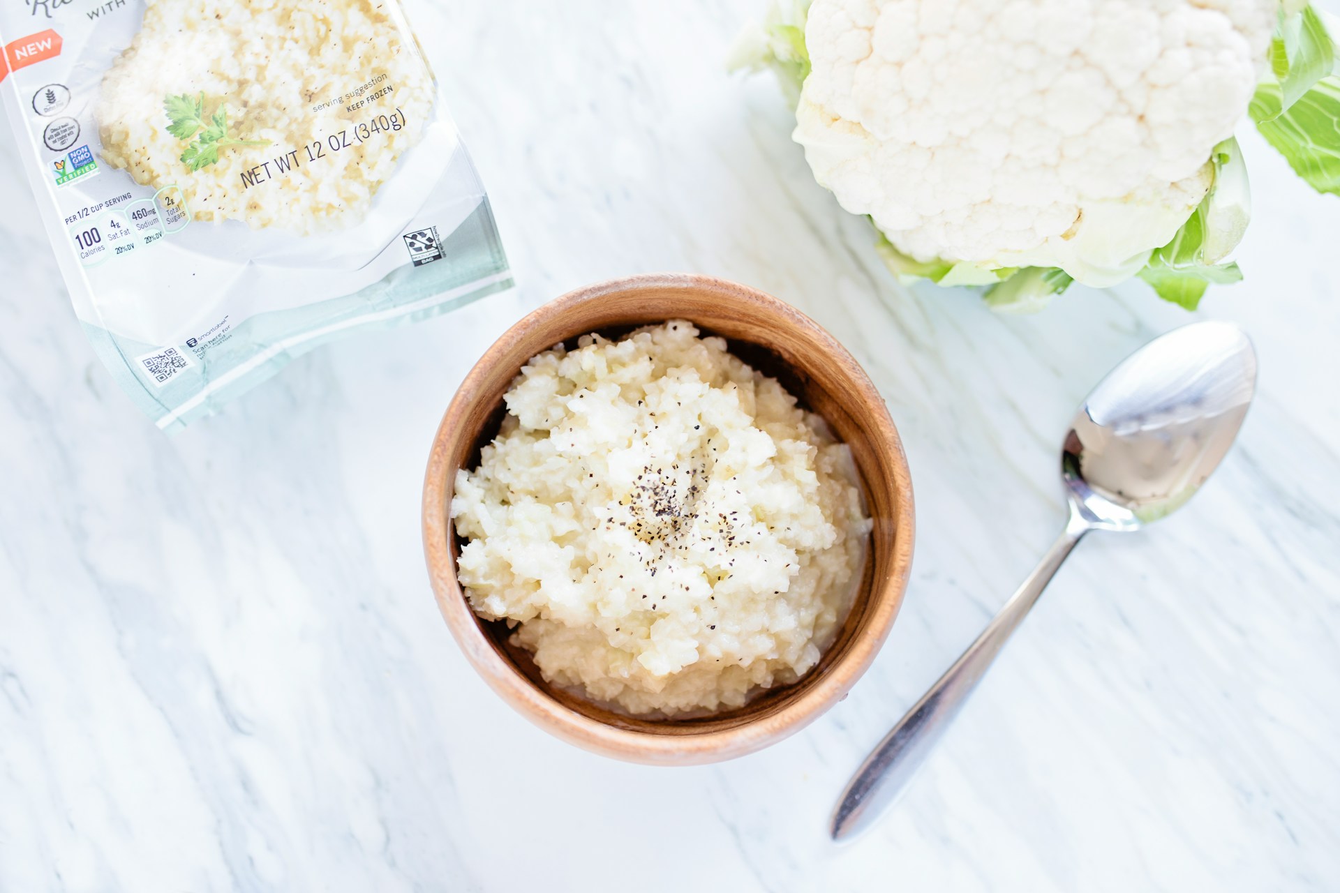 Cauliflower rice in a wooden bowl
