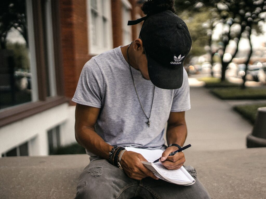 How To Address an Envelope pictured: person writing