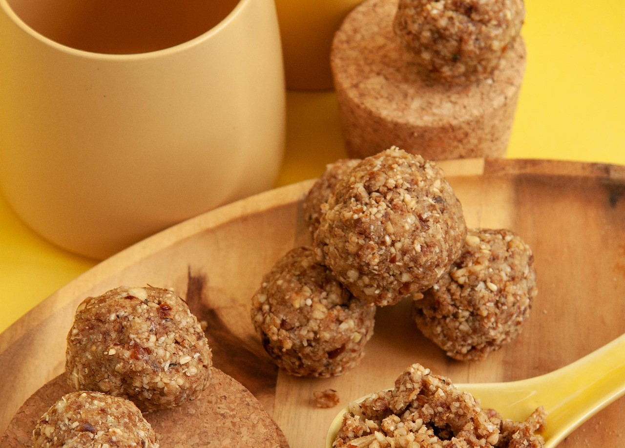 Energy balls with oatmeal on a spoon