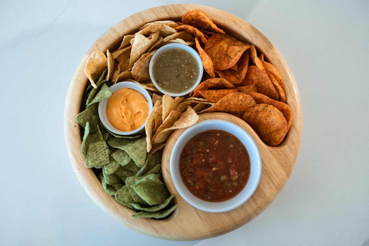 Tortilla chips, melted cheese, salsa, green chips