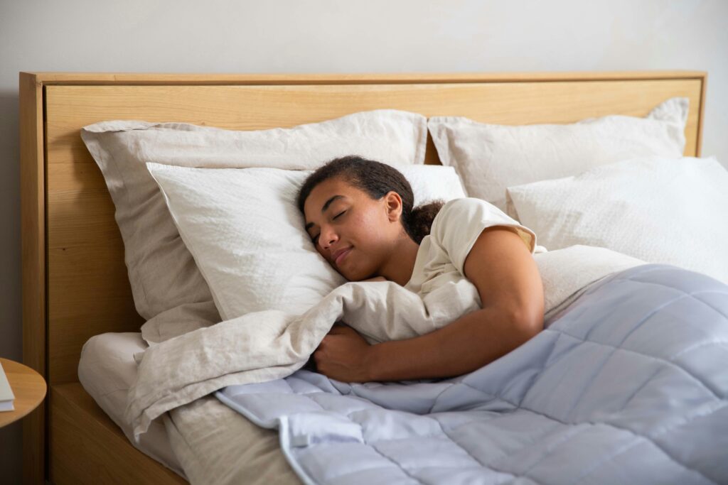 What Is Sleepmaxxing? pictured: person sleeping soundly