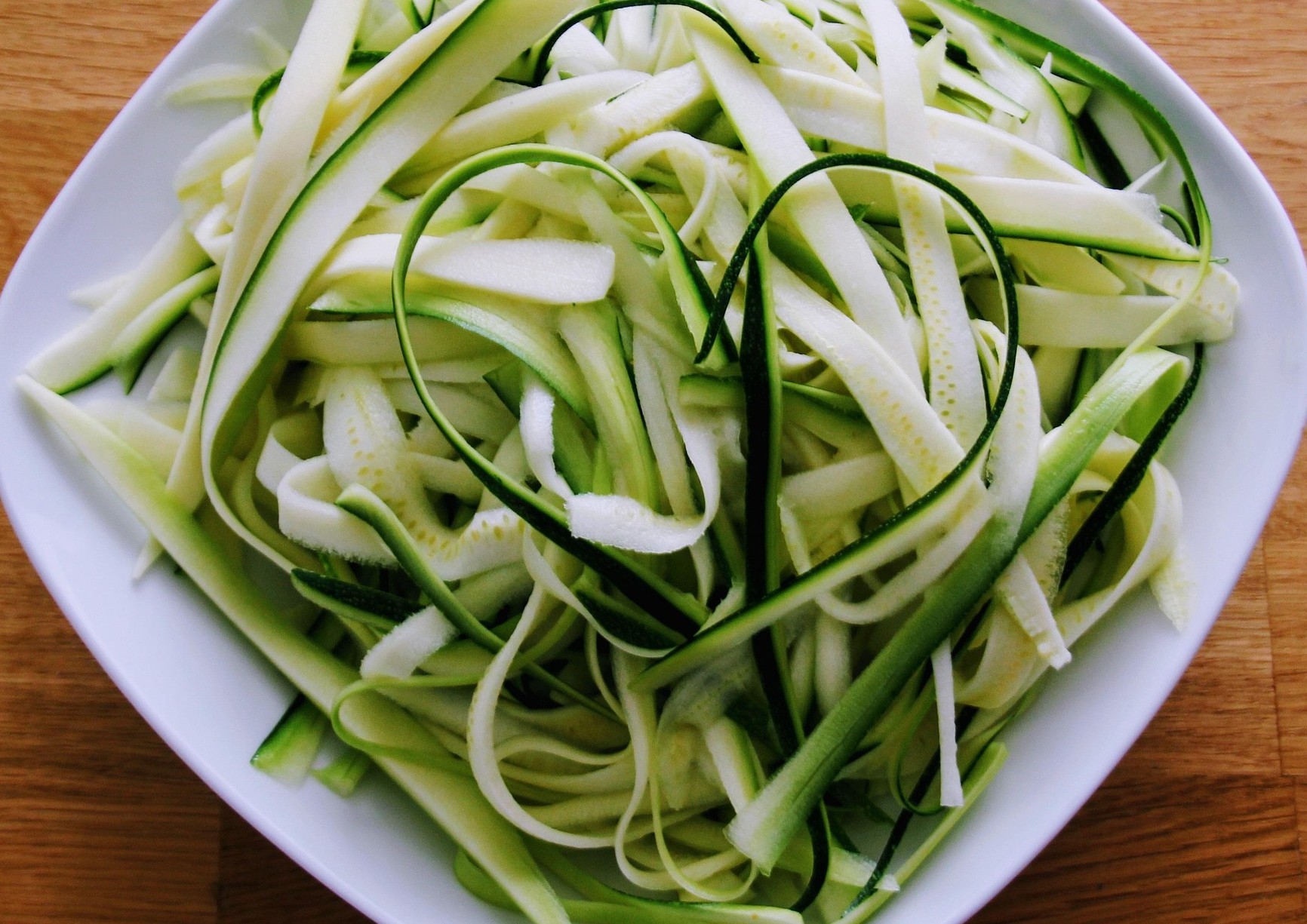 Zucchini noodles on a white plate