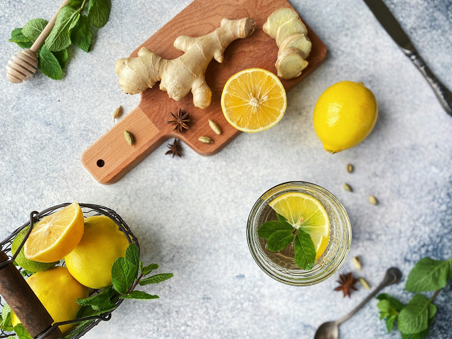 Ginger on a cutting board near lemon slices