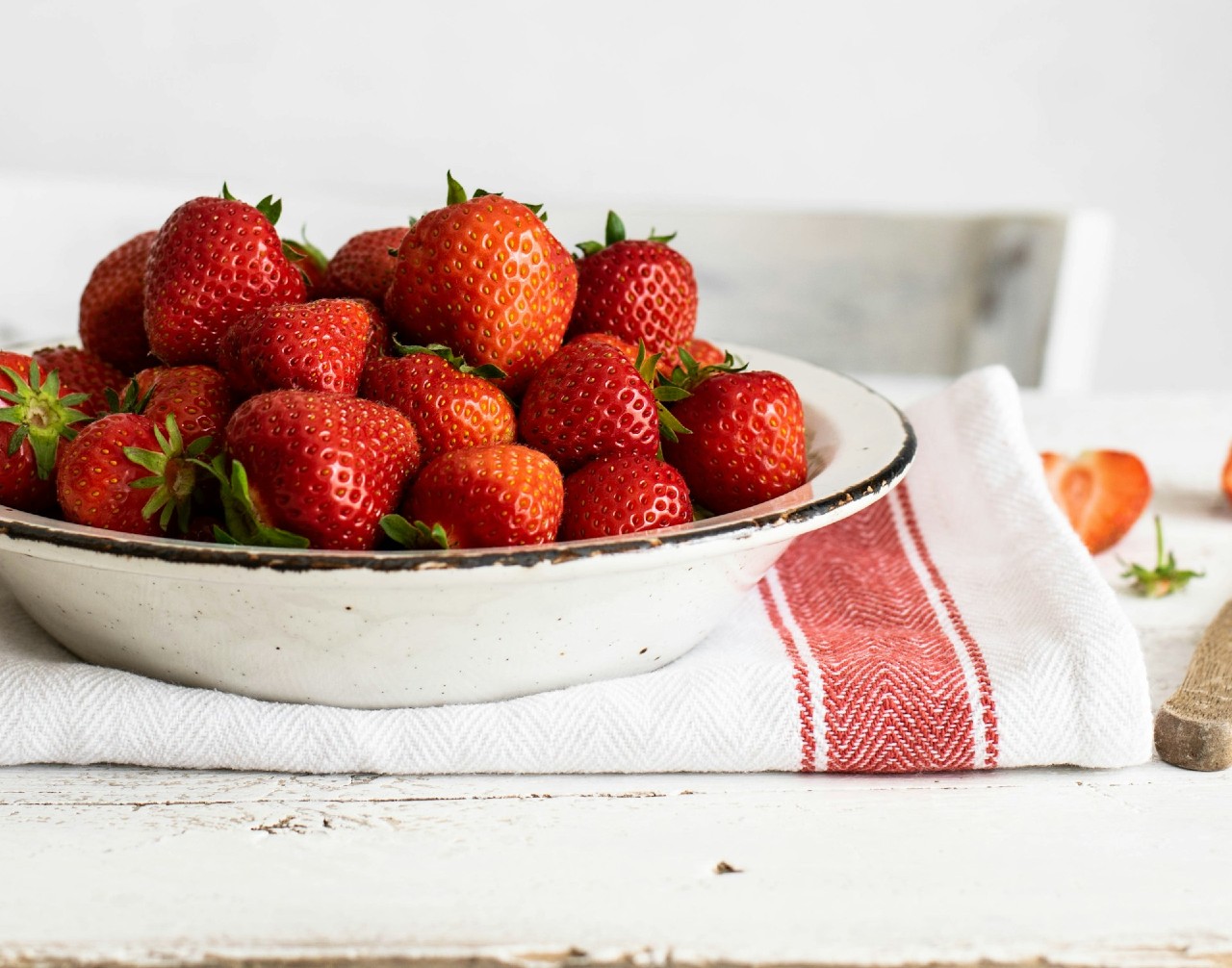 Bowl of strawberries over a towel