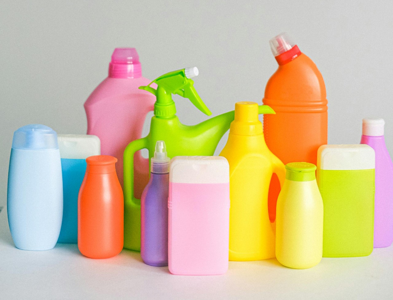 Multi-colored cleaning solutions in brandless bottles