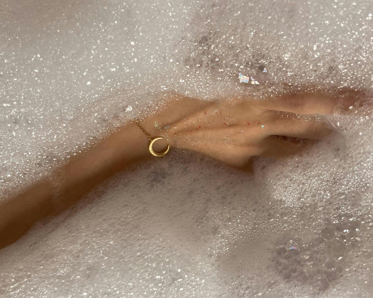 A hand in soapy water