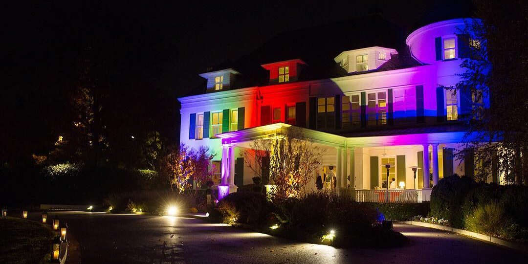 Number One Observatory Circle at night with rainbow-colored lights. 